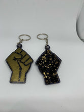 Load image into Gallery viewer, fist bronze with transparent black with gold flakes