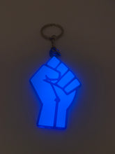 Load image into Gallery viewer, fist blue glow in dark with transparent blue background
